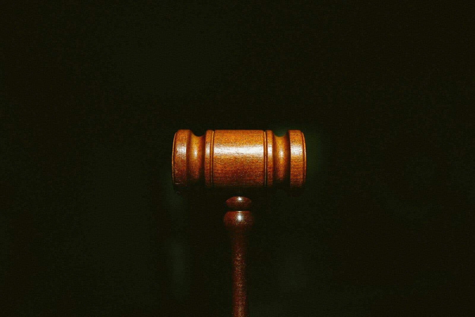 brown wooden stand with black background