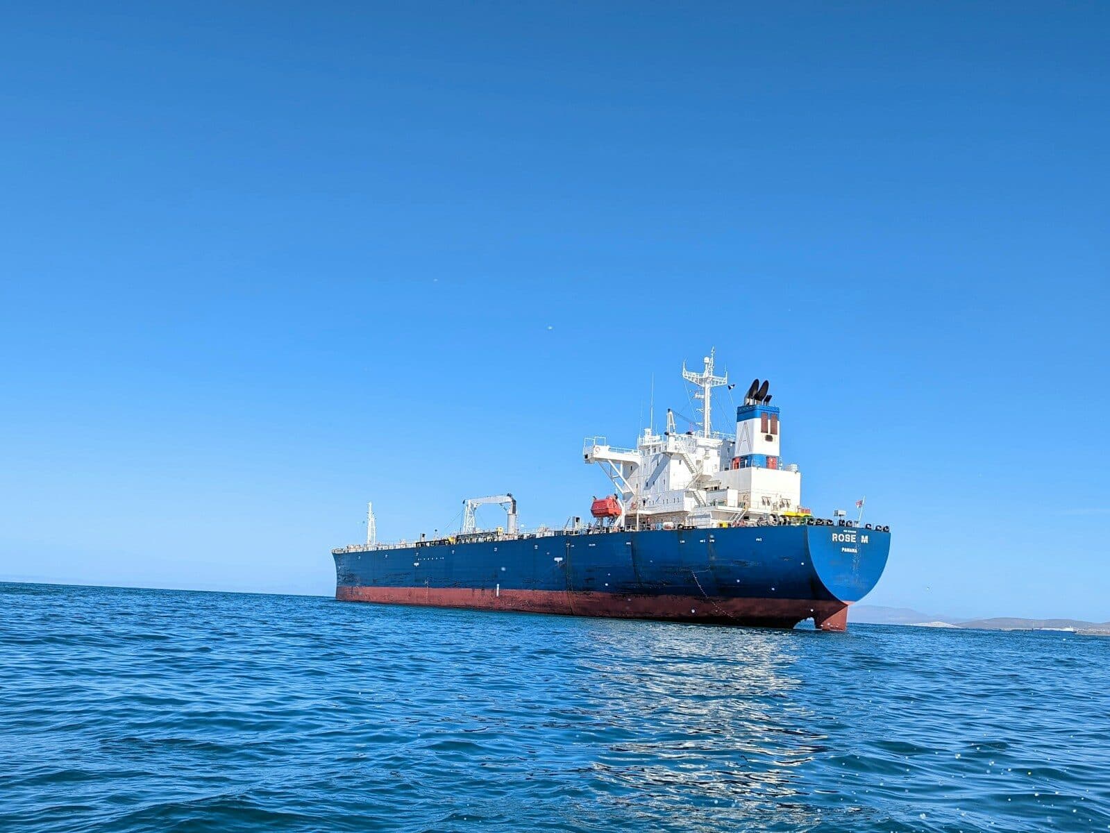 a large boat floating on top of a body of water