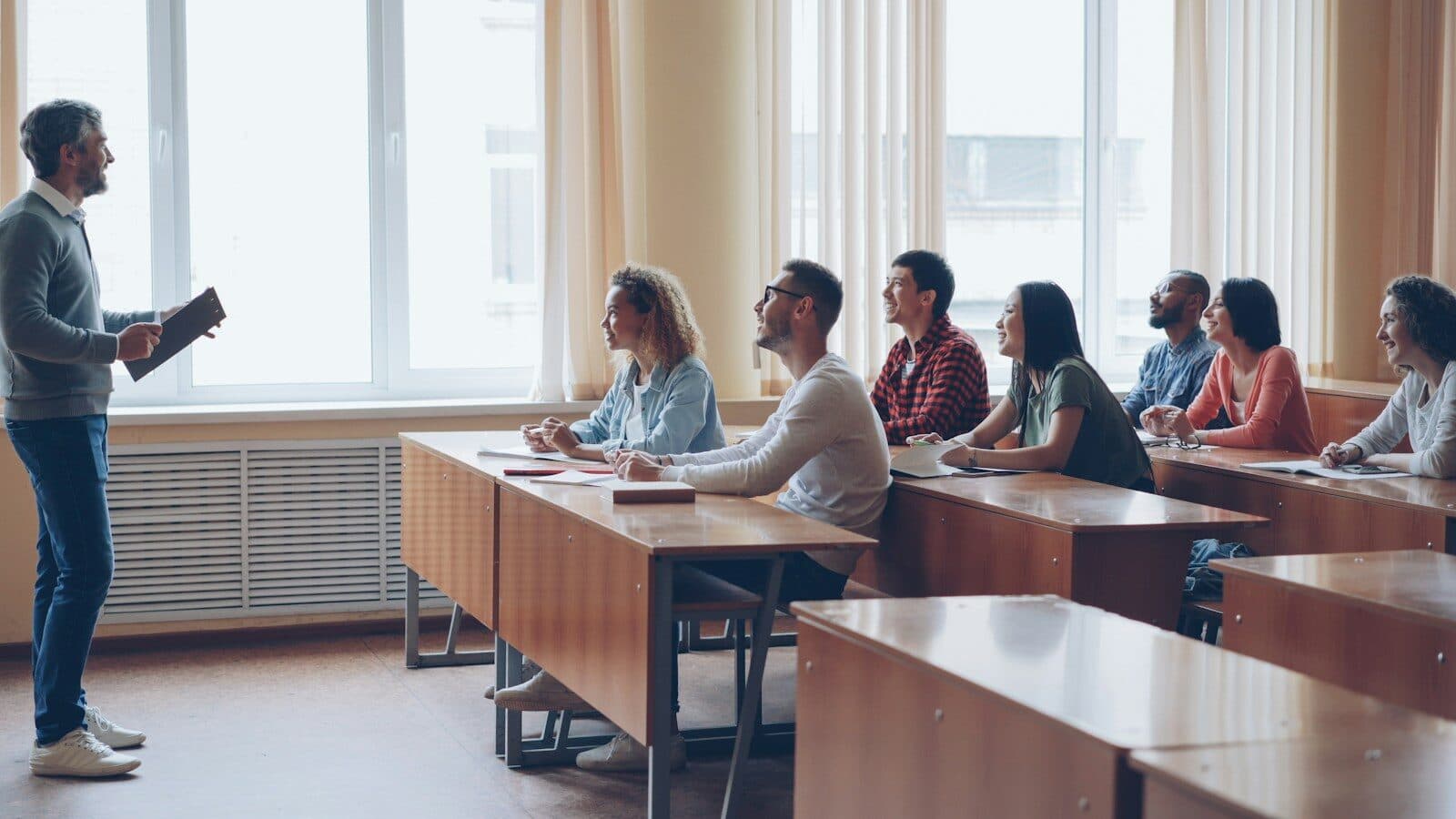 Professor lecturing to students in a classroom